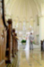 At the altar, the couple takes their vows.