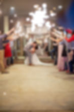 A new husband dips and kisses his bride.