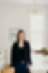 Woman smiling, the founder of Epilogue, Nadine.