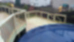 two tiered pool deck w/ green treated wood