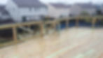 two tiered pool deck w/ green treated wood