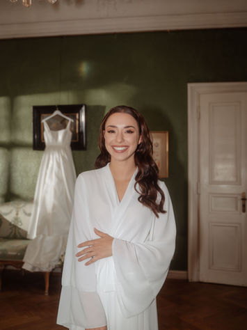 Bride standing in soft light during a styled shoot at Schloss Offenberg - embodying elegance, confidence, and quiet grace.
