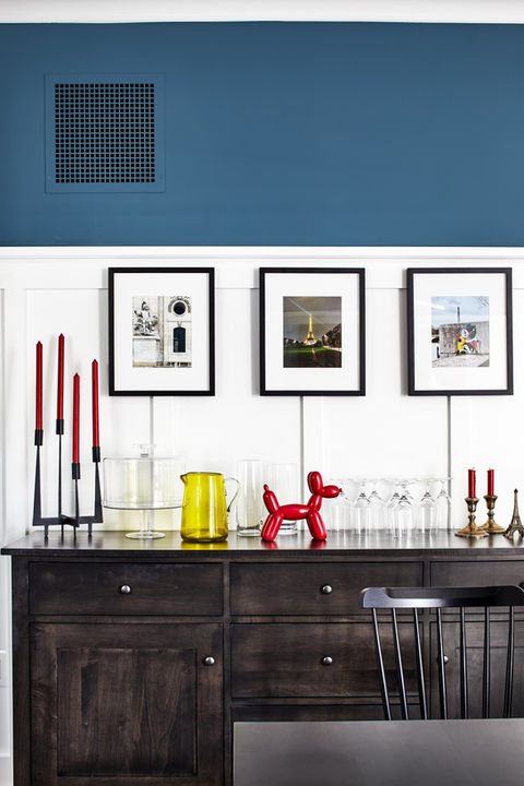 Closeup of dining room sideboard decorated with colorful accents