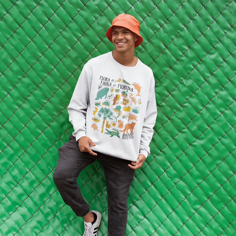 Man wearing Florida Flora & Fauna crewneck sweatshirt with hand-drawn wildlife design.
