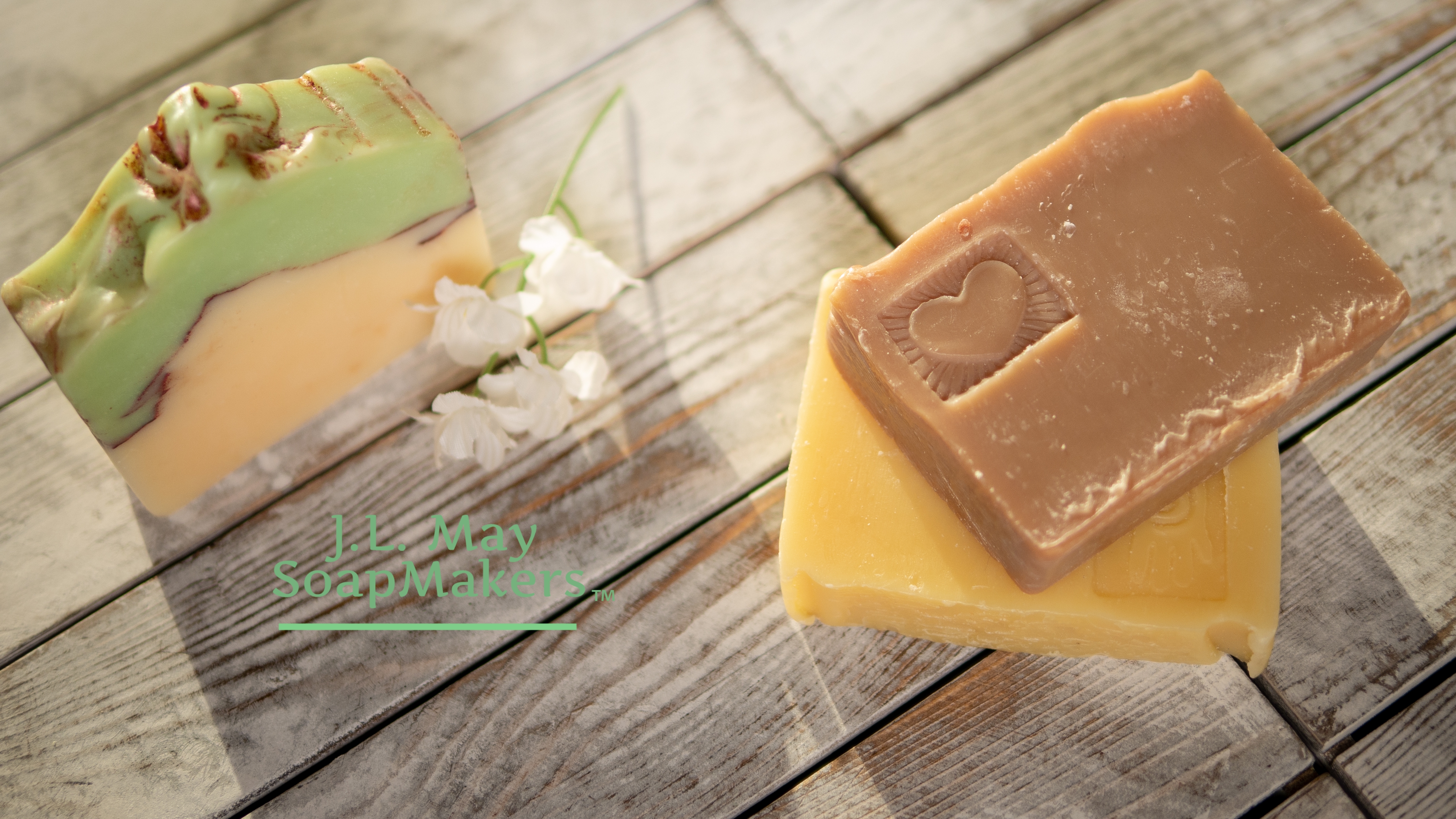 J.L. May SoapMakers gift card image - a stack of soap with logo