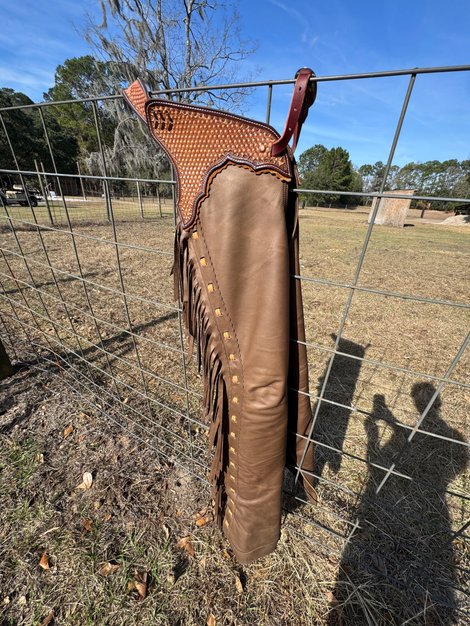 The Cake Chaps- Custom western chaps made of Taupe smooth out with caramel lacing and scalloped edge, with a unique honeycombed stamp design in yoke.