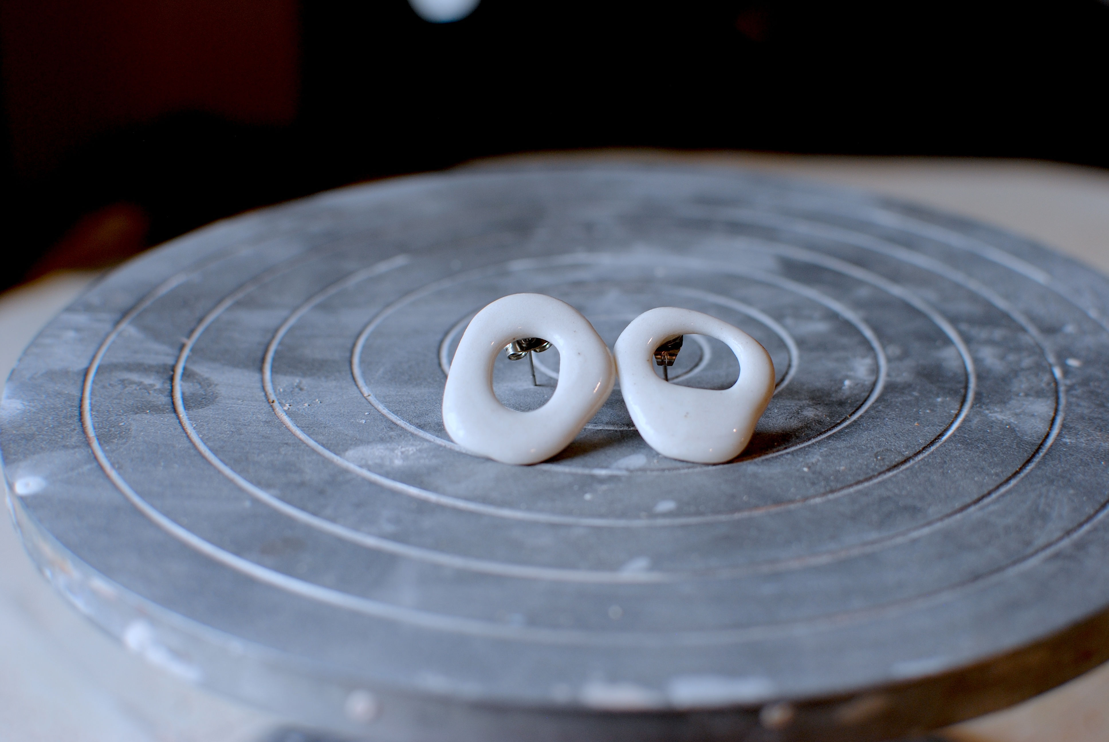 White organic circle studs