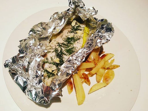 Baked fish parcels with hand cut chips and simple salad