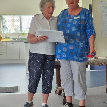 Two women reviewing a document.