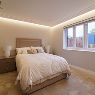 Modern bedroom with large window and natural light
