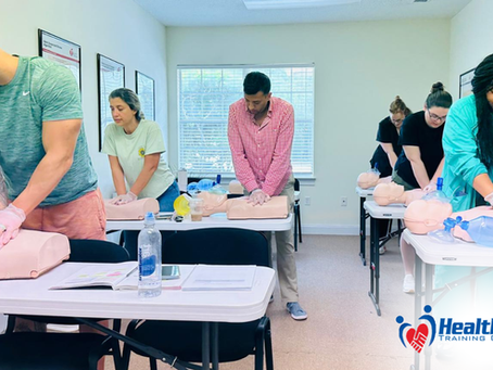 Instructor demonstrating hands-only CPR technique during an AHA CPR course in Jacksonville, Florida at HealthForce Training Center