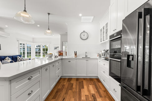 High gloss kitchen with beautiful timber floorboards