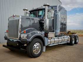 A polished grey Kenworth truck