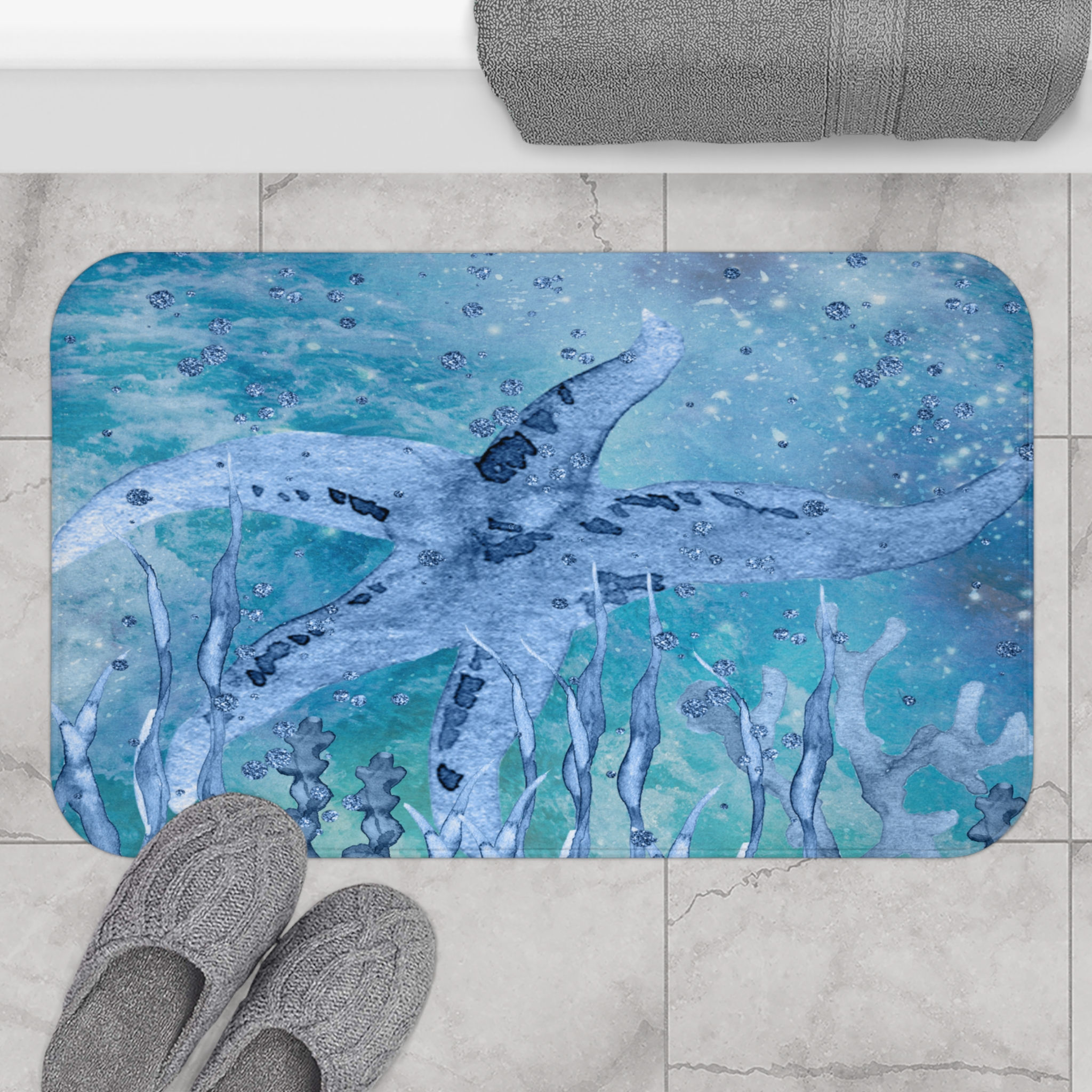 Deep Blue Sea Watercolor Starfish Design Bath Mat displayed on a bathroom floor.