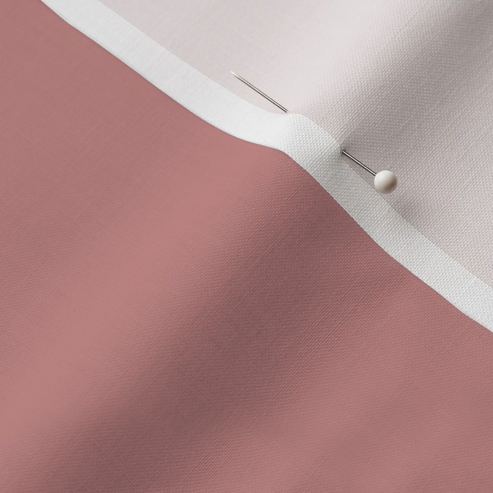 Close-up of Dusty Rose Cotton Prima fabric showing the finished edge and texture.