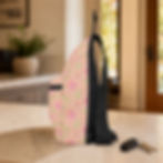 Left-side view of the Blush Pink Watercolor Floral sling bag showing the adjustable black strap and side construction.