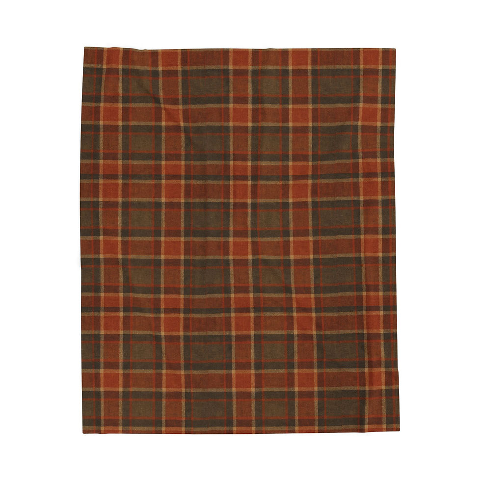 Close-up view of the rust and olive plaid blanket pattern.