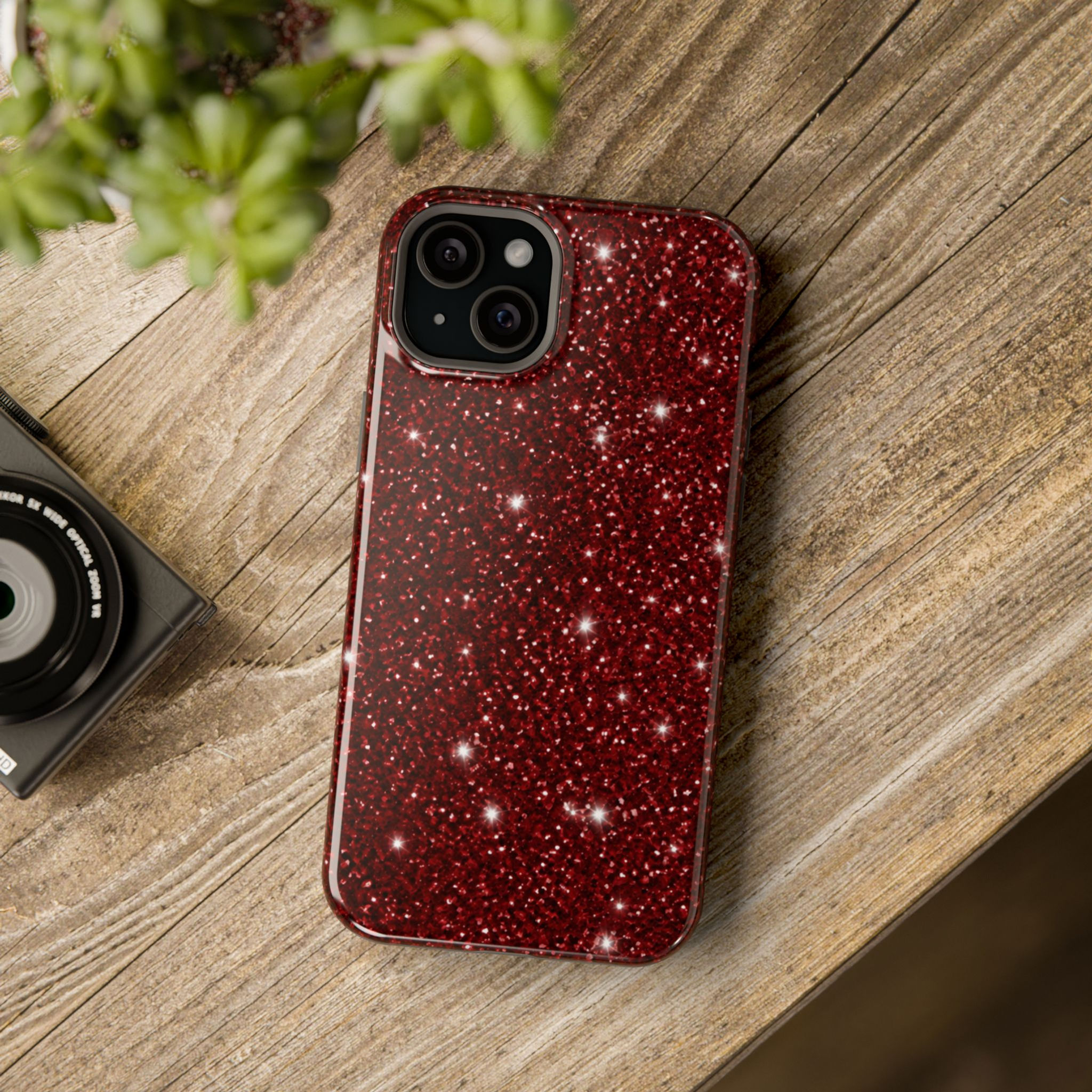 Deep Red Sparkle phone case styled on a wooden table.