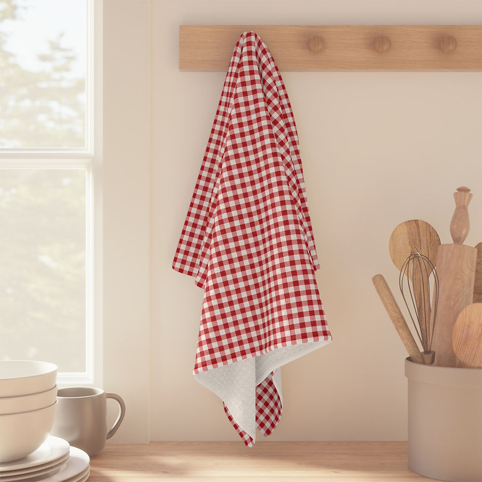 Red gingham kitchen towel hanging on a wall hook in a farmhouse kitchen.