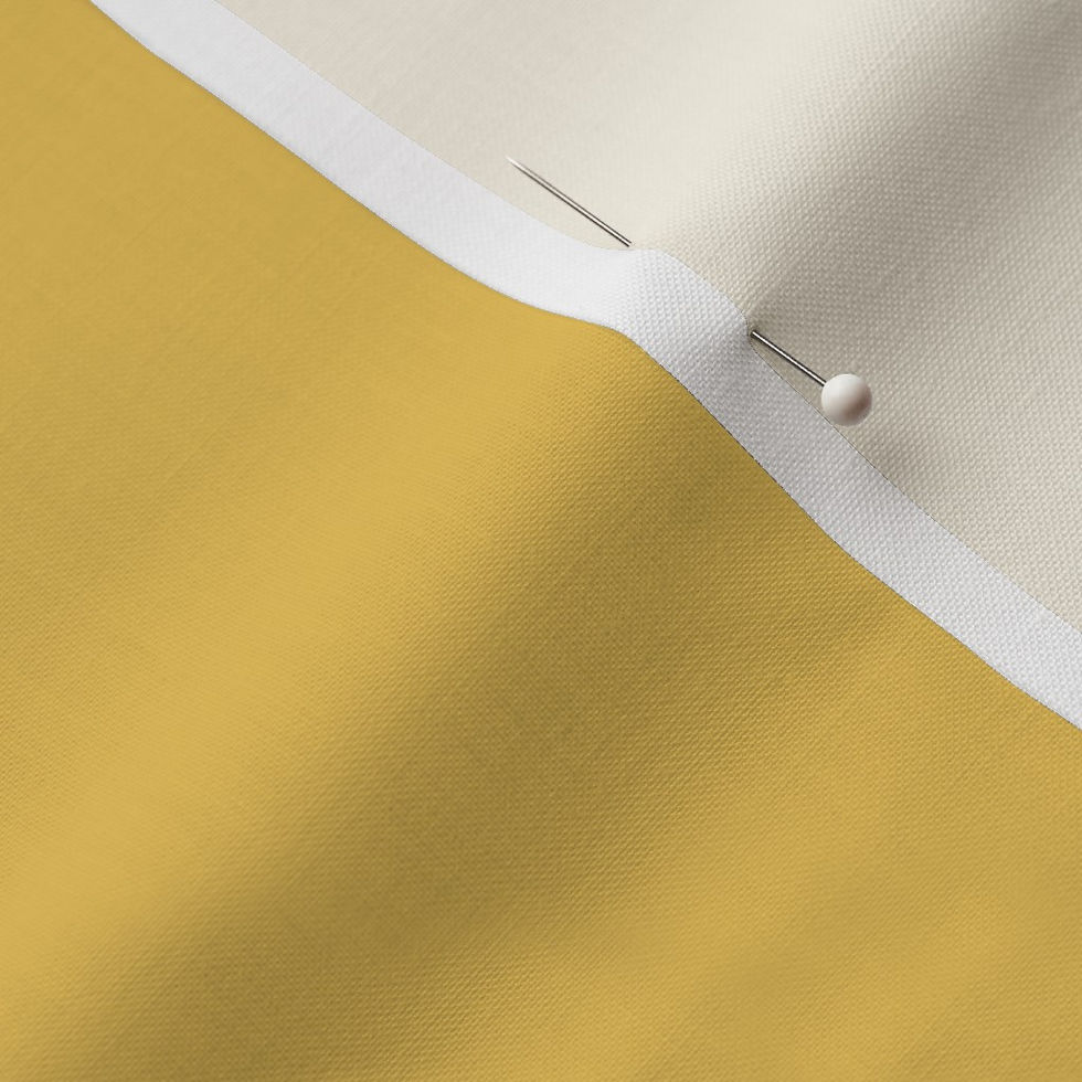 Close-up of Butter Churn Yellow Cotton Prima fabric showing the finished edge and texture.