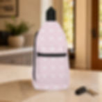 Vintage Pink Floral Argyle sling bag facing forward on a kitchen counter beside car keys
