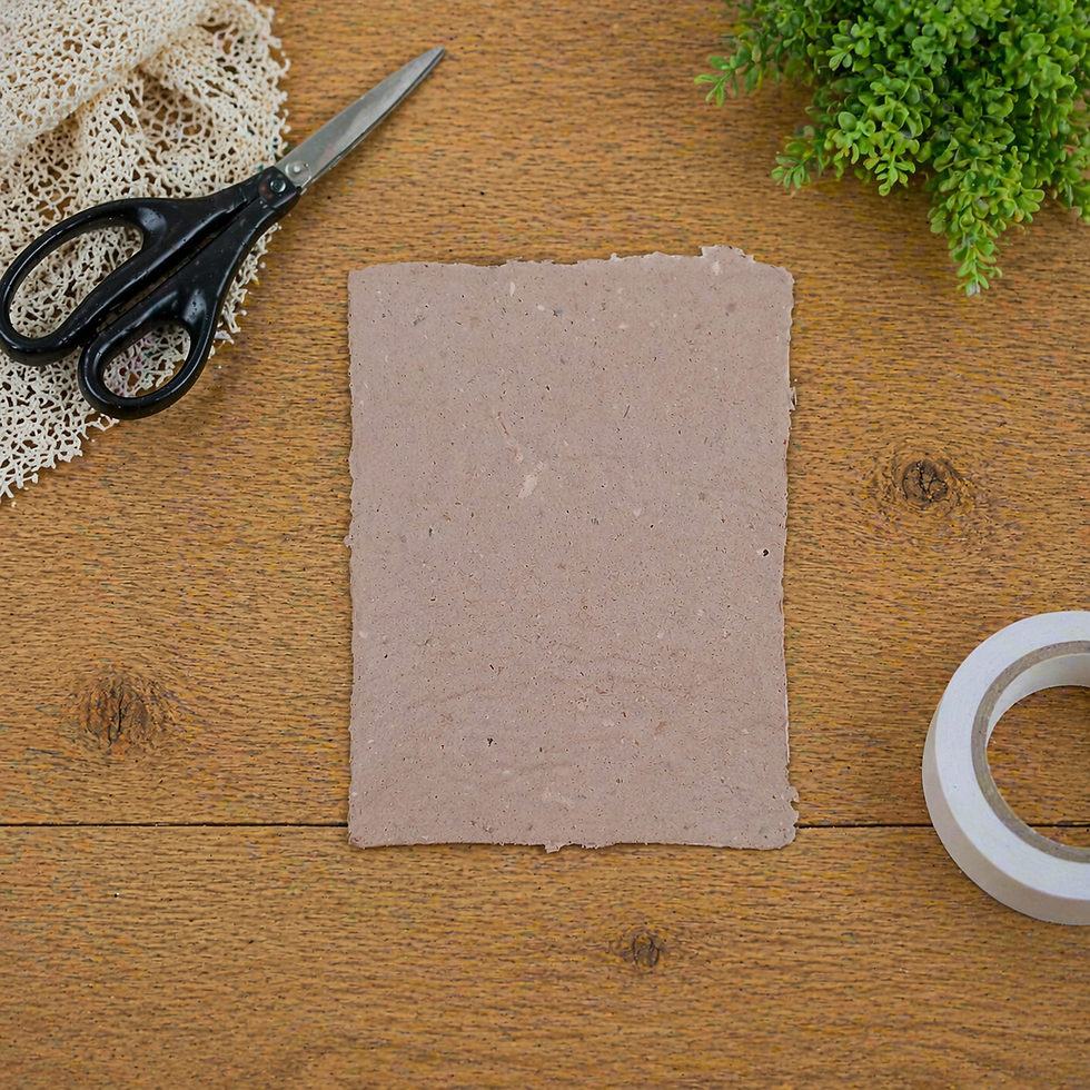 Single sheet of handmade paper displayed on a craft table.