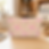Blush pink watercolor floral T-bottom pouch standing in a craft room.