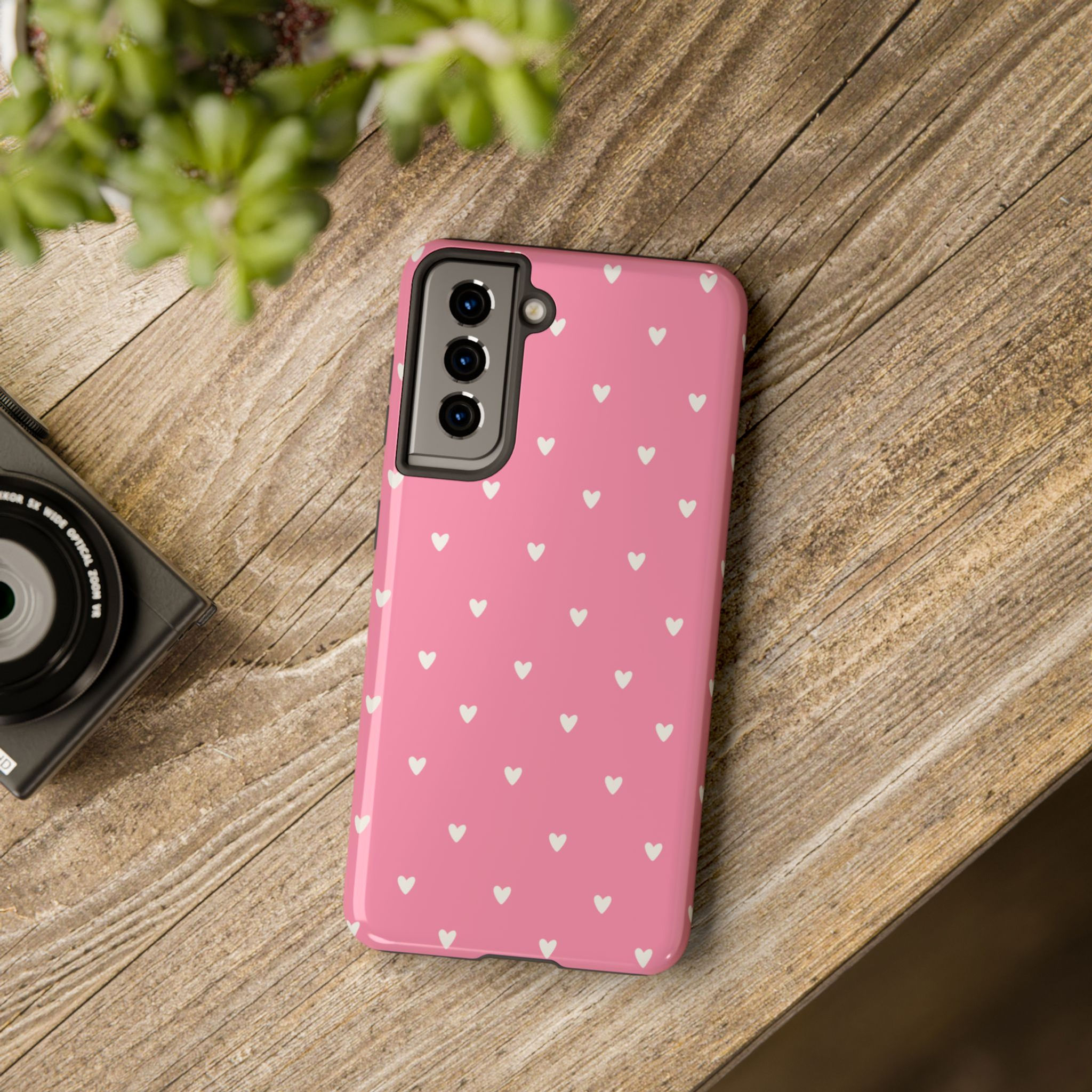 Soft Pink Heart phone case displayed on a wooden table