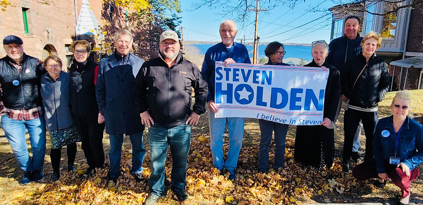 Stev Holden out in NY24 with a group of supported, with his campaign banner that reads Holden for N724
