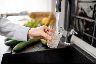 Water Glass filling at sink.jpg