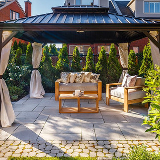 gardening sitting area in gazebo in small backyard