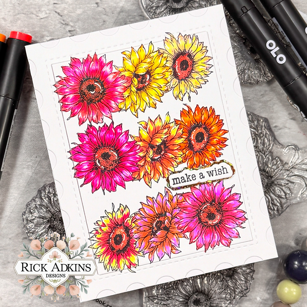 Colorful sunflower card with pink, orange, and yellow blooms. Text reads "make a wish." Two markers are visible on the side.