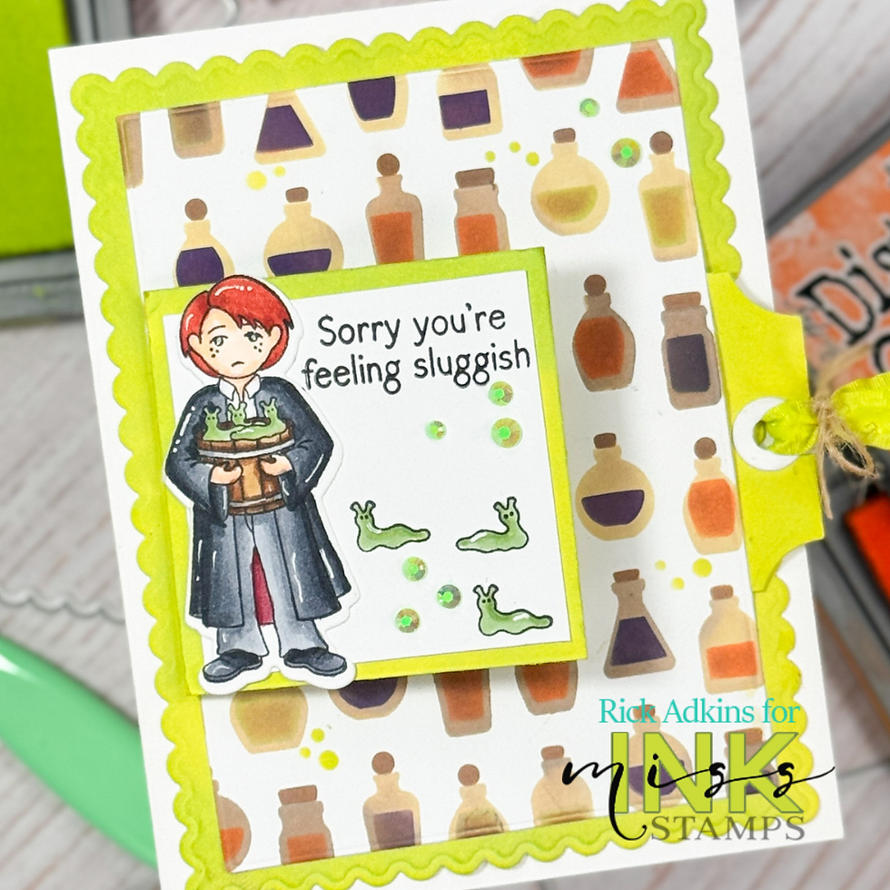 Cartoon person holding a bubbling potion on a card with a bright border. Text reads "Sorry you're feeling sluggish" with green slugs.