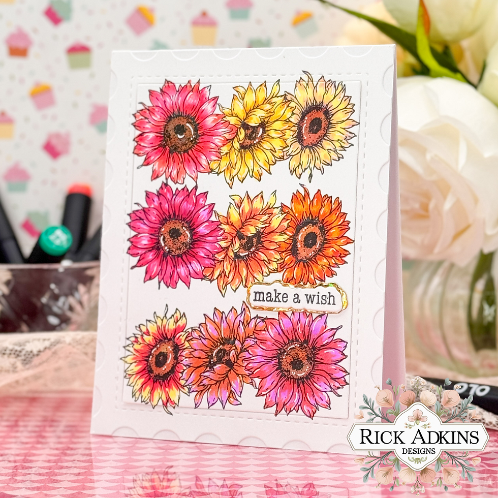 Colorful floral card with pink, yellow, and orange flowers, text "make a wish" in front, set against a pastel patterned background.