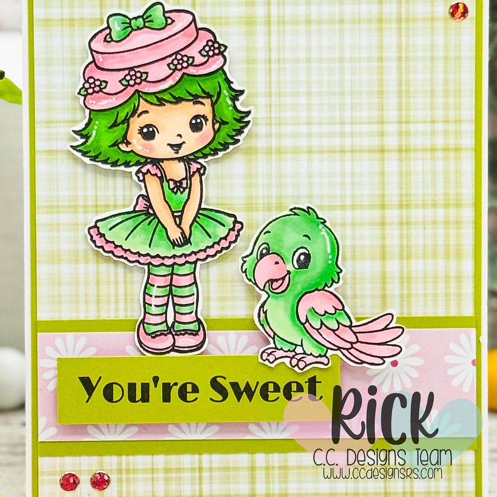Cute handmade card with a green-haired girl in a pink hat and a green-and-pink parrot above the text You're Sweet.