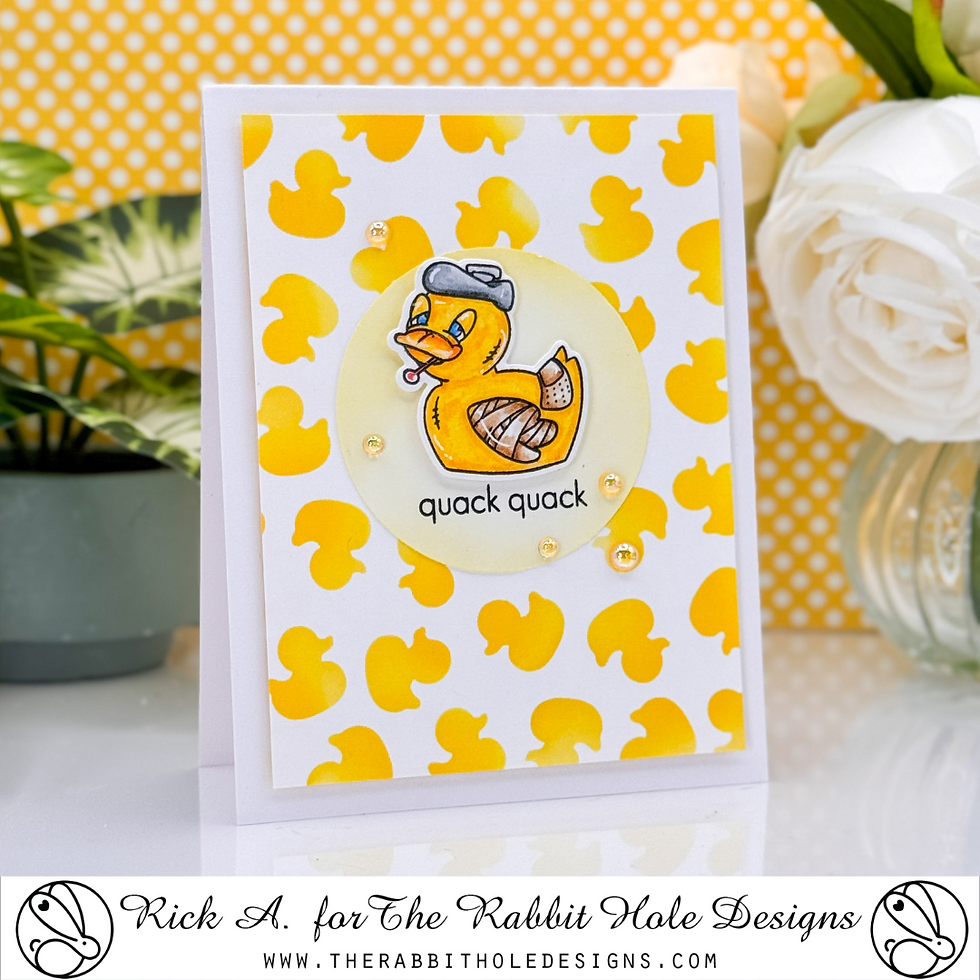 Card with yellow duck illustration, bandaged, wears a hat. Text reads "quack quack." Yellow duck pattern background, white roses nearby.