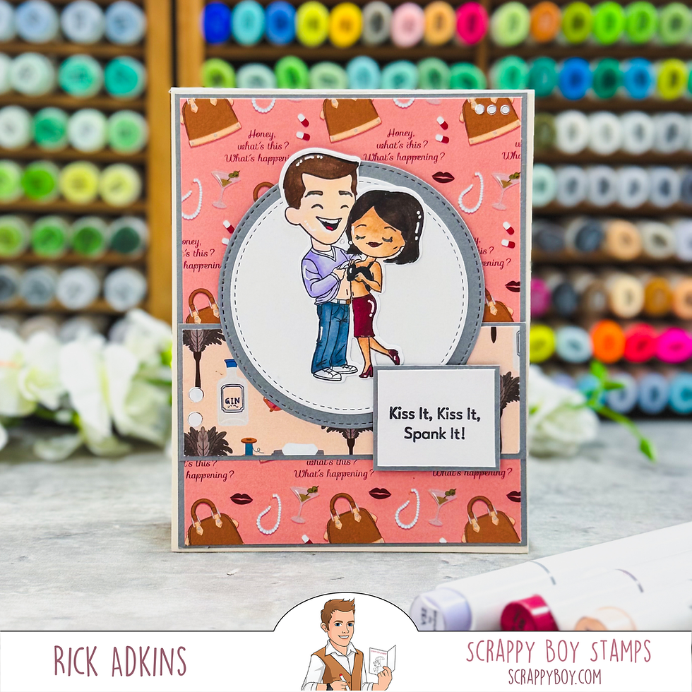 Handmade greeting card with a smiling cartoon couple, pink patterned background, and text: Kiss It, Kiss It, Spank It!