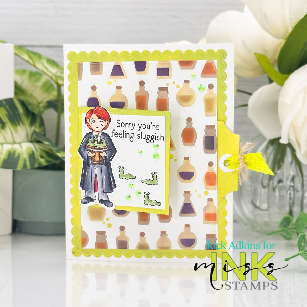 A card with a red-haired person holding a pot. Text reads "Sorry you're feeling sluggish." Background has potion bottles and slugs.