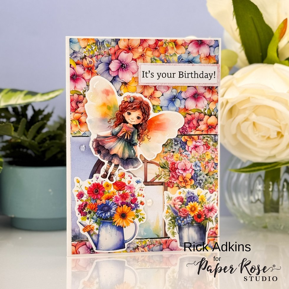 A fairy with orange wings hovers over vibrant flowers. Text reads "It's your Birthday!" against a floral background. Playful mood.