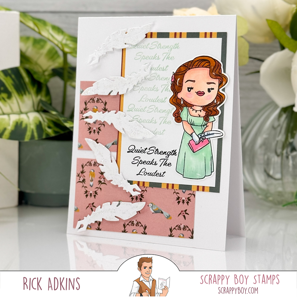 Handmade card with a cartoon woman in a green dress holding a book. Text reads "Quiet Strength Speaks the Loudest." Pink, feather accents.