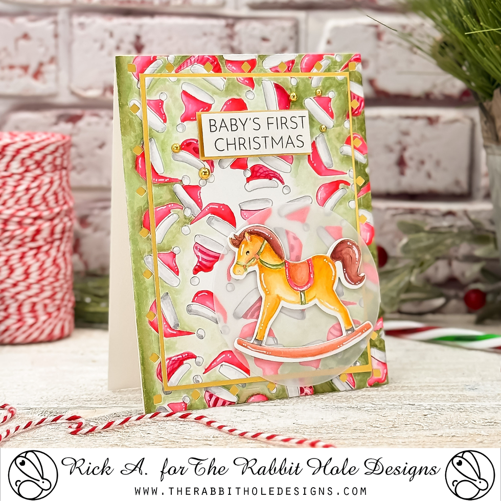 Holiday card with a yellow rocking horse and "Baby's First Christmas" text. Festive background with red, green, and white patterns.