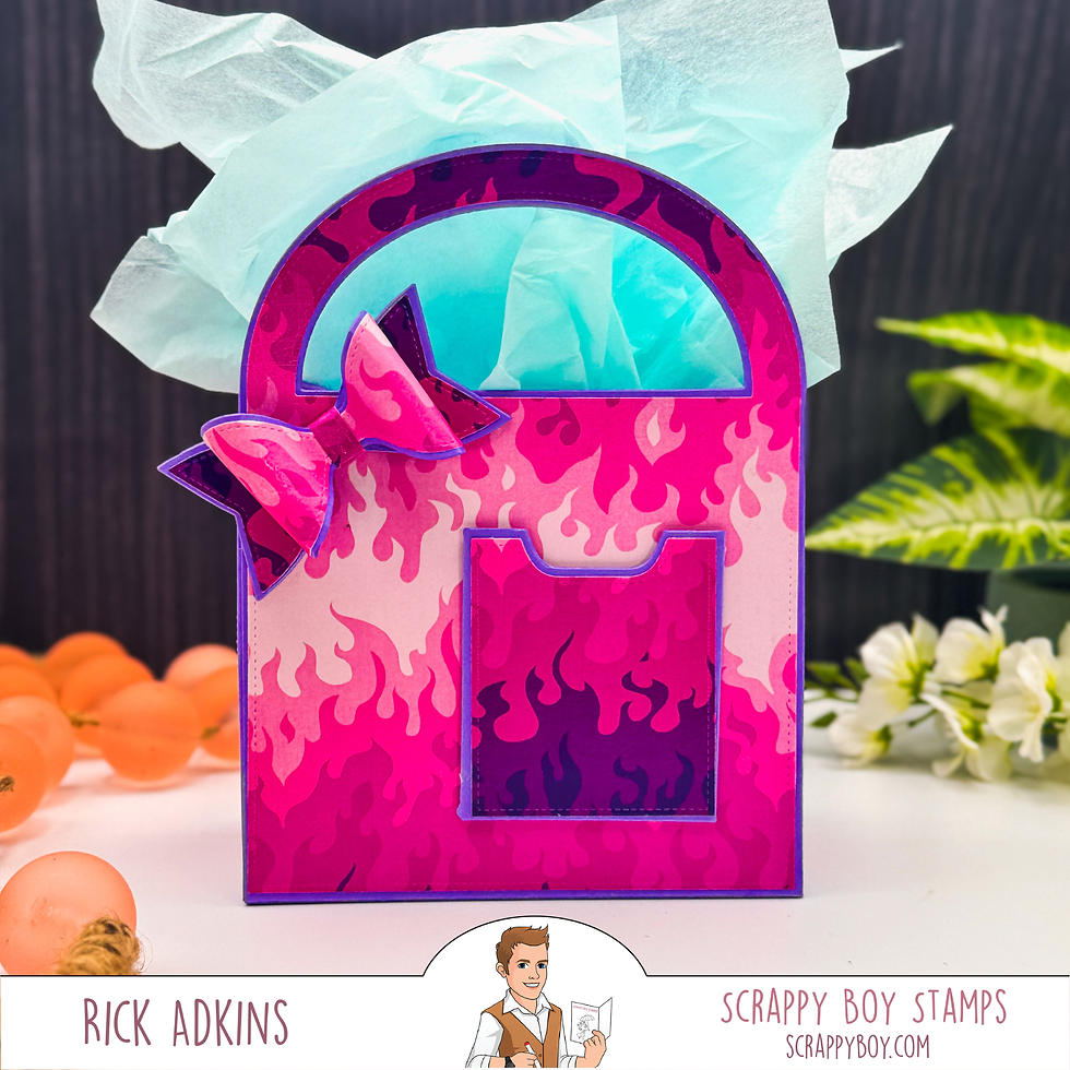 Bright pink and purple gift bag with flame pattern and bow, filled with blue tissue. Background shows oranges and white flowers.