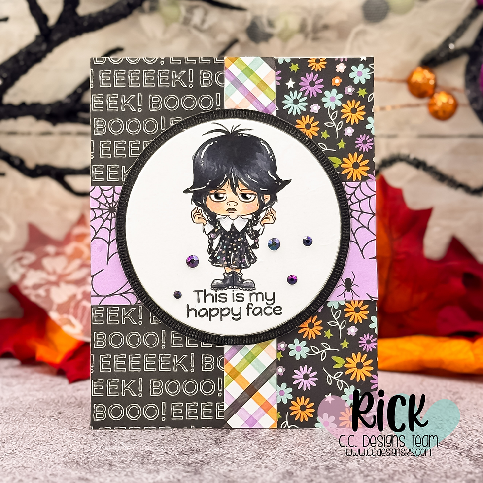 Cartoon girl with a grumpy face on a Halloween-themed card. Text reads "This is my happy face." Background has "EEK!" and "BOO!"