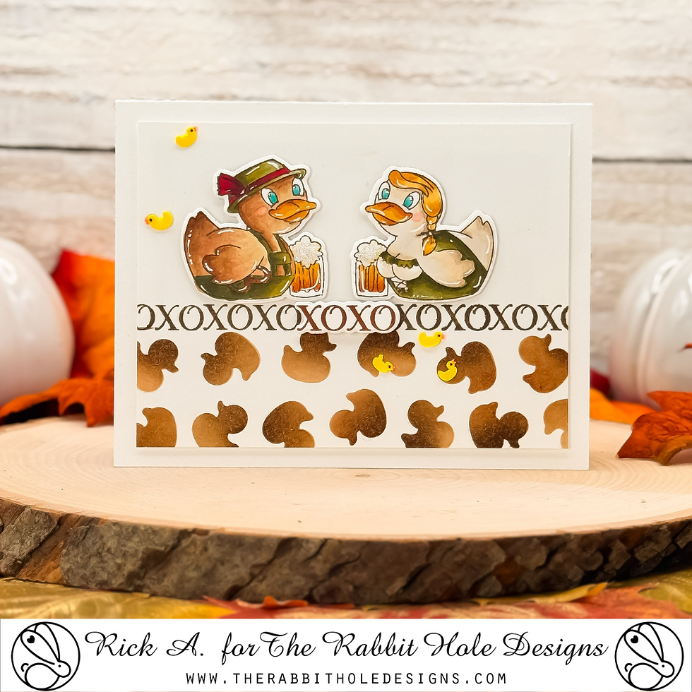 Two cartoon ducks in traditional attire hold beer mugs on a festive card with acorn patterns. Background includes autumn leaves.