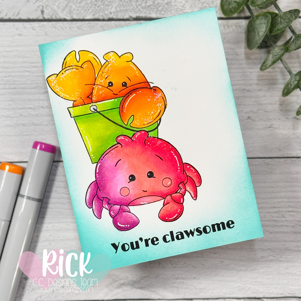 Cute cartoon crabs, one red, one orange in a green bucket, on a card reading "You're clawsome" with markers and leaves nearby.