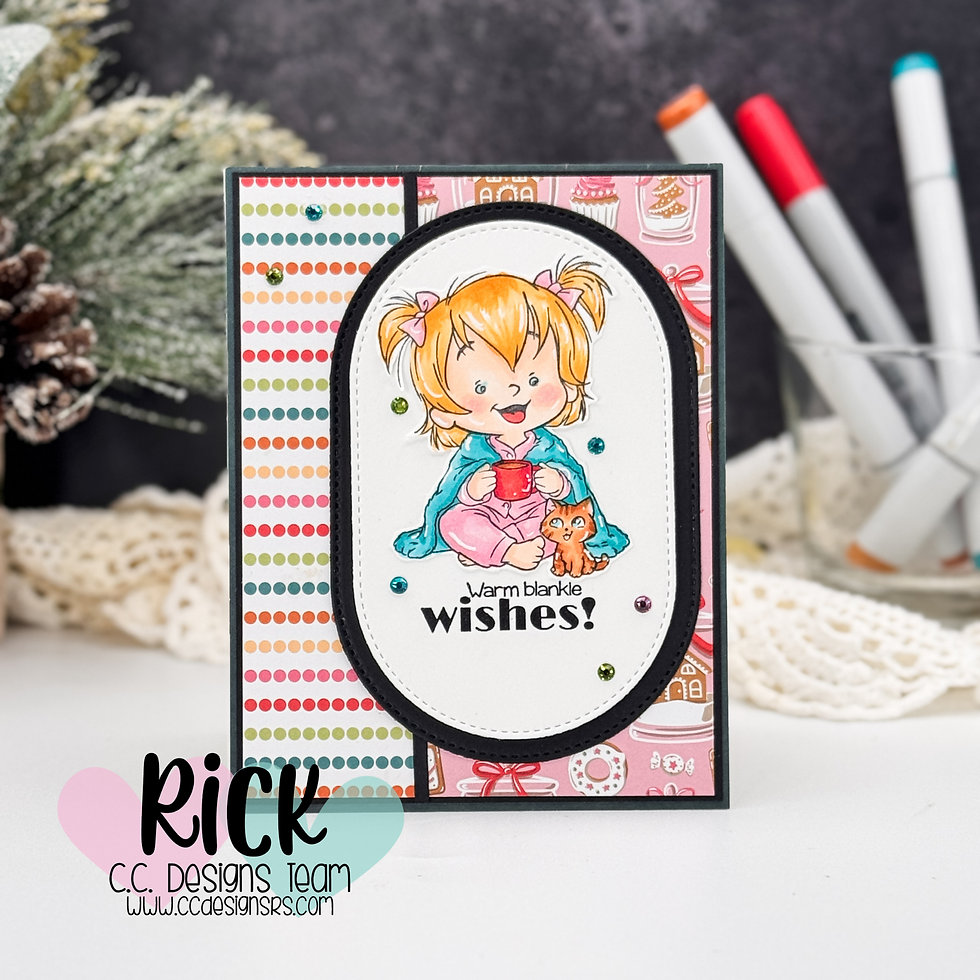 Card with a girl holding a red mug, wrapped in a blanket with a small cat. Text reads "Warm blankie wishes!" Colorful patterns and pinecones.