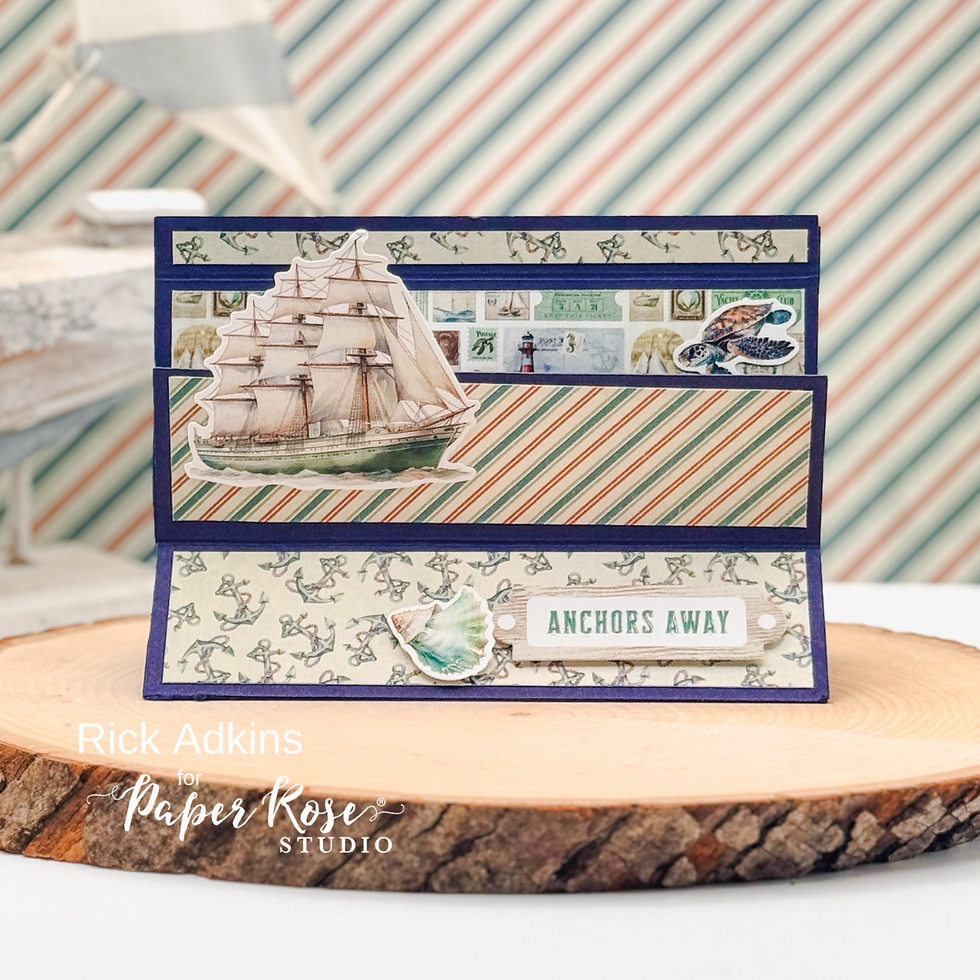 Nautical-themed card with a ship illustration, striped patterns, and "Anchors Away" text. Set on wood slice with striped background.