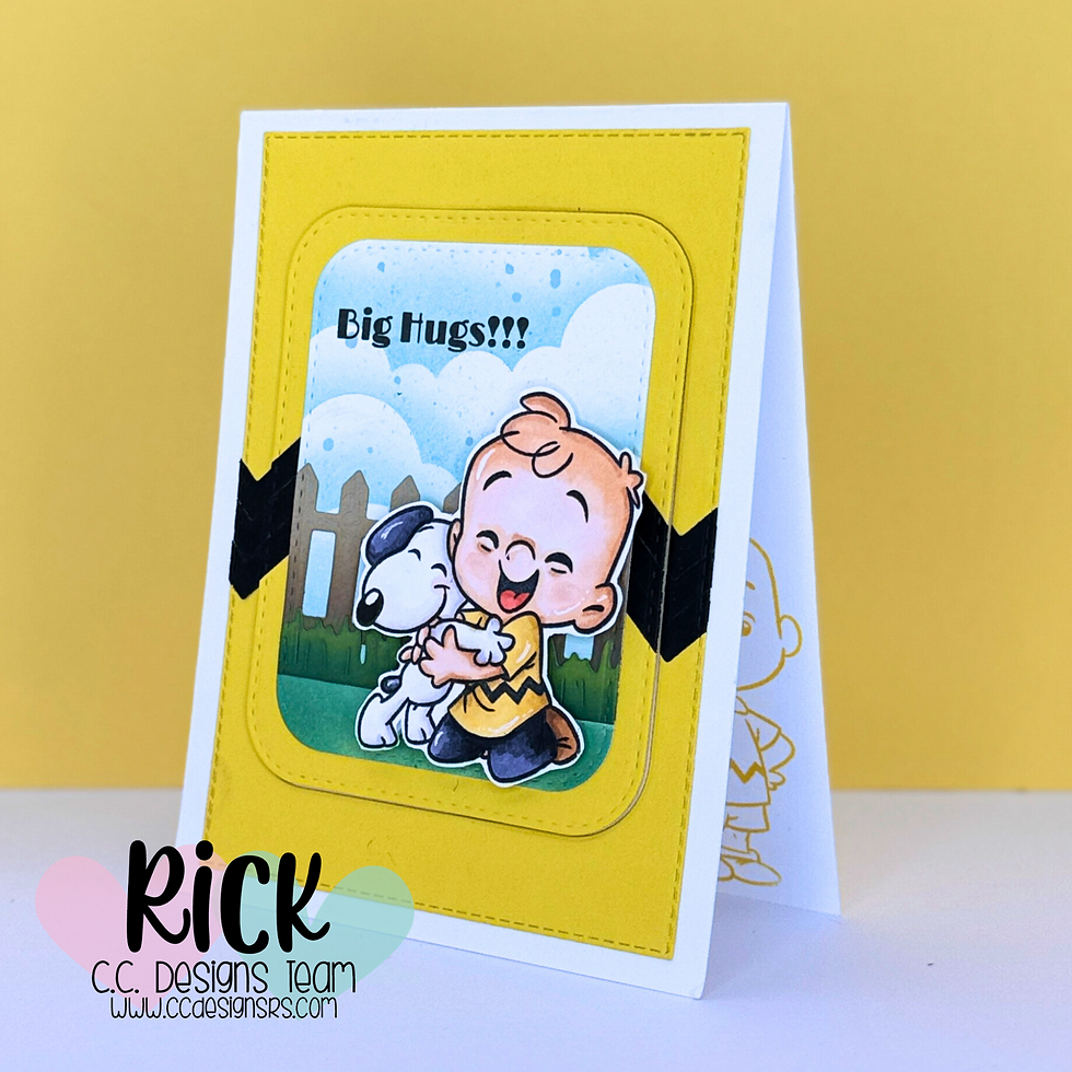 A cartoon boy hugs a dog on a bright yellow card with "Big Hugs!!!" text. Background features a fence and sky. Mood is joyful.