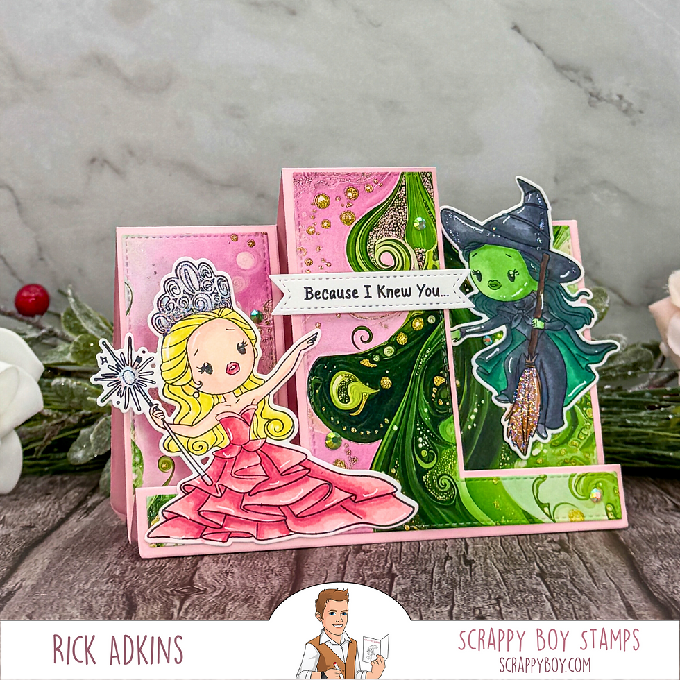 Cartoon Glinda and Elphaba on a card with pink and green swirls. Text reads "Because I Knew You..." Decor and flowers in background.