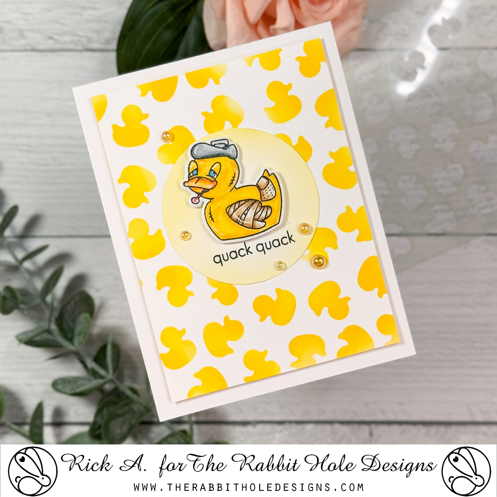Greeting card with a yellow rubber duck wearing a cap and bandages, saying "quack quack." Background features yellow duck silhouettes.